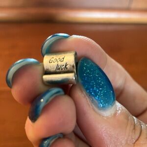 Pandora Sterling Silver scroll “Good Luck” charm.